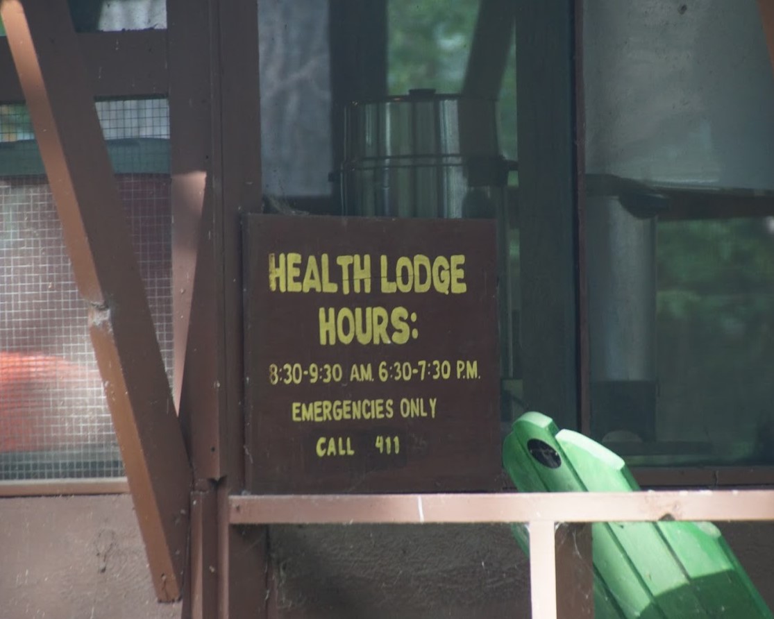 The Health Lodge sign with posted open hours